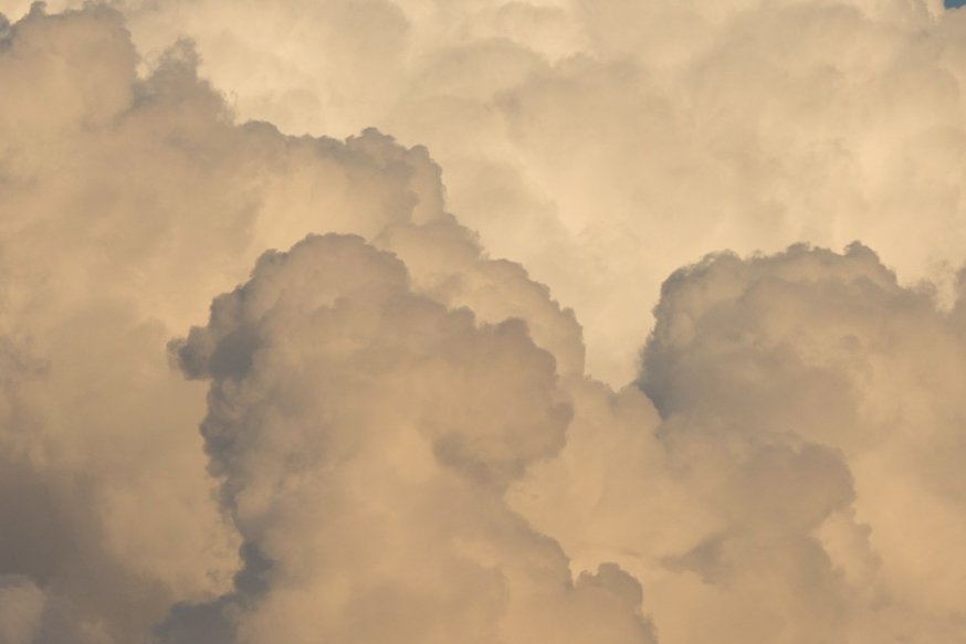 Soft towering clouds in warm light